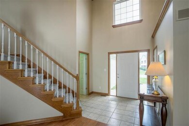 Front foyer. Ceramic tile entry. 17 ft ceiling.