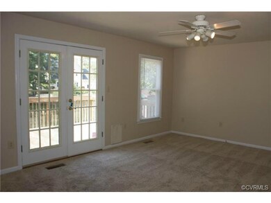 Family Room has access to deck and fenced rear yar