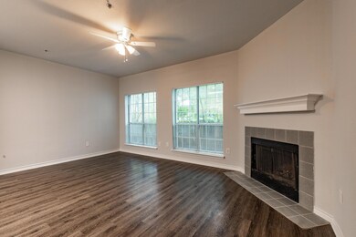 Unfurnished living room featuring a ceiling fan, 