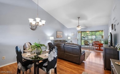 Dining space with a chandelier, ceiling fan, light