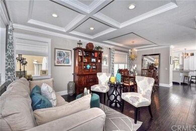 Enter into the home with rich wood floors, cased w