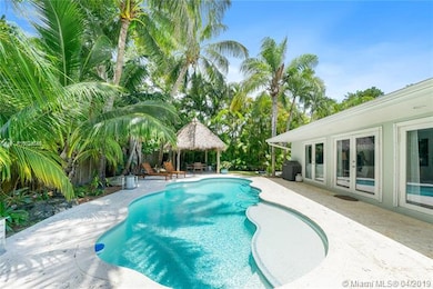 Large free form pool and coral paver patio installed in 2014 with LED lighting and pool heater