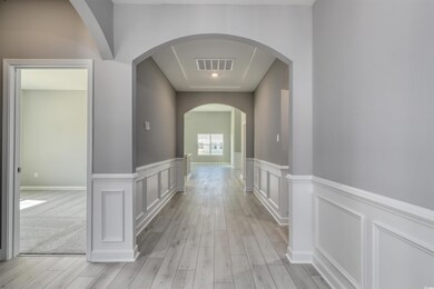 Hallway featuring light wood-type flooring