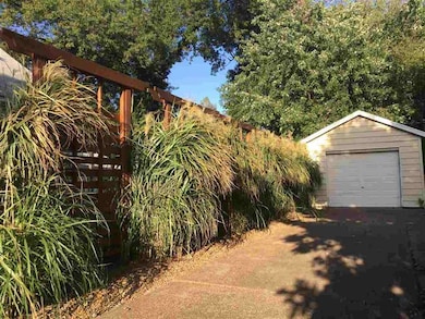Detached one car garage with near ornate privacy b