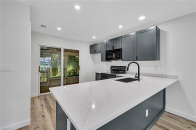 Kitchen featuring visible vents, light wood-type f