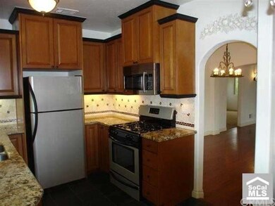 Kitchen with dining view of entry to dining room