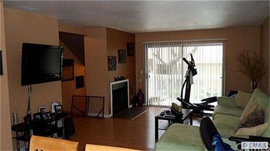 Living room with new floors and fireplace leading 
