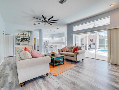 Family Room, looking into kitchen and out to pool area