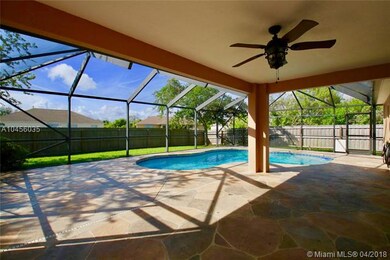 Covered Patio with View to Screen Covered Pool
