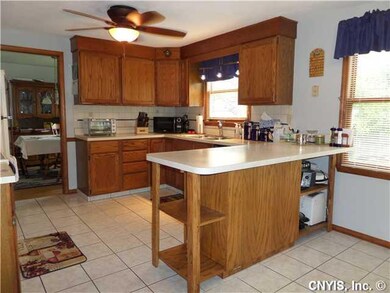 Kitchen Gourmet kitchen with tile flooring, added peninsula, nice cabinets, all appliances