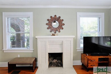 FIREPLACE IN LIVING FLANKED BY WINDOWS FOR EXTRA S