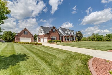 This beautiful home with detached garage, in-ground pool and hot tub offers approximately one acre of privacy.
