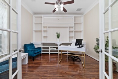 The study offers plenty of natural light and a built-in bookcase.