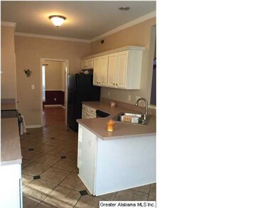 The custom floors continue in the kitchen as well,