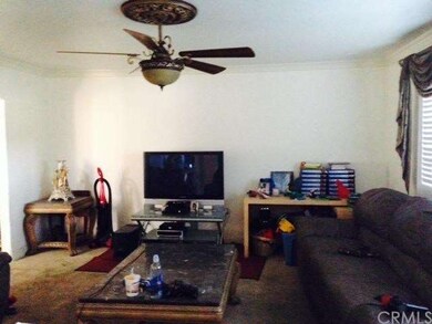 Large living room with ceiling fan