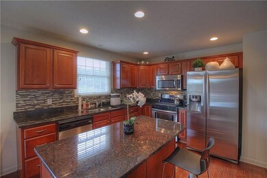 Kitchen with center island, stainless appliances, 