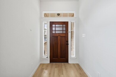 Entrance foyer featuring light wood-type flooring