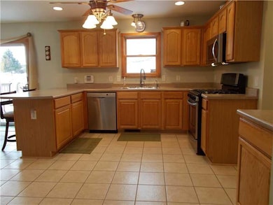 Kitchen. Oak cabinets and ceramic tile floor