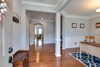 Inviting Entry Foyer with Crown Molding, Hardwoods