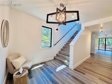 Cozy entryway leading either to upstairs or non-co