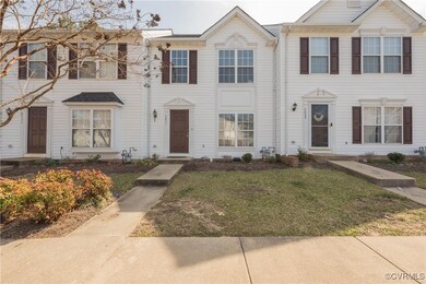 View of property with a front yard