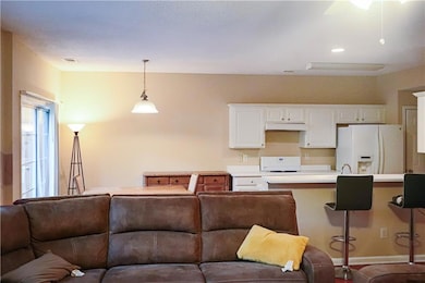 Kitchen with white cabinets, a kitchen breakfast b