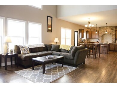 The two story great room is open to the kitchen an