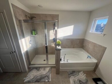 Bathroom with tile patterned floors and independen