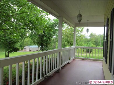 FRESHLY PAINTED WRAP AROUND PORCH