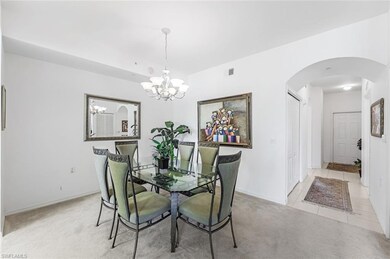 Dining area with a notable chandelier and light co