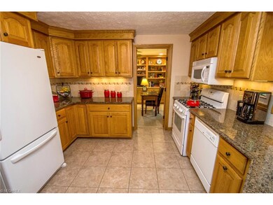 Kitchen features granite counters, DuraCeramic flo