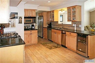 Newly remodeled gourmet kitchen with wood laminate