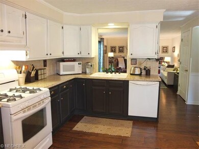 Kitchen with tile backsplash, walk in pantry, eati