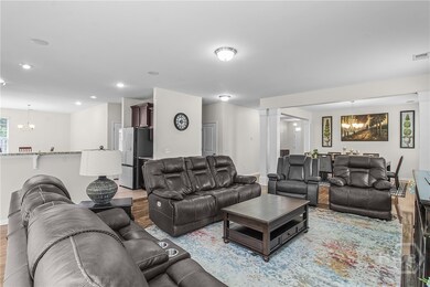 Great Room Open to Formal Dining Room and Kitche n