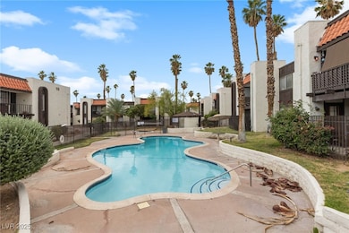 Community pool featuring a residential view and a