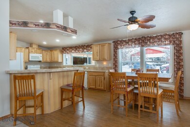 Dining area with view to bar and kitchen.
