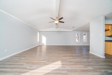 Unfurnished living room with a textured ceiling, l