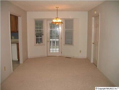 Breakfast area offers fresh paint and carpet, and great views of private backyard. This room has access to back deck.