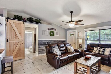 Barn door allows you to close off bedroom wing and acts as a door over built-in cabinet