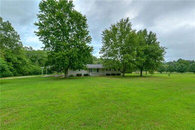 Home sets on a beautiful level lawn