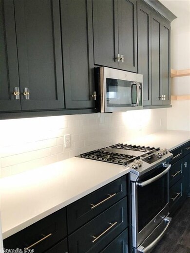 White Quartz Countertops + Acrylic and Brass Pulls