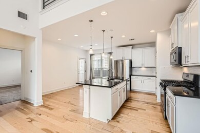 Kitchen featuring stainless steel appliances, a s