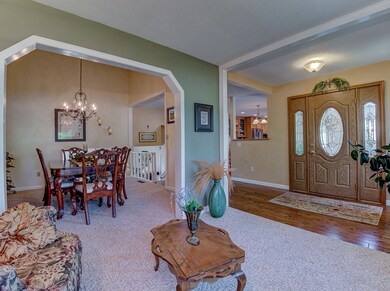 Sitting room to entry and dining