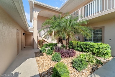 Property entrance featuring stucco siding