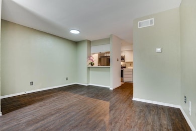 Living room featuring dining area and updated ligh