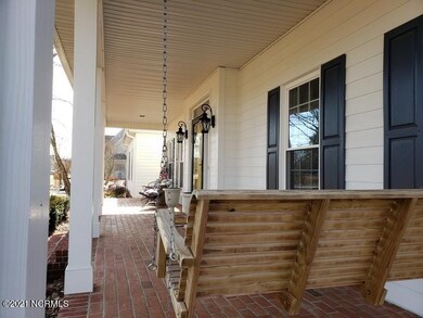 FRONT PORCH WITH BRICK FLOOR