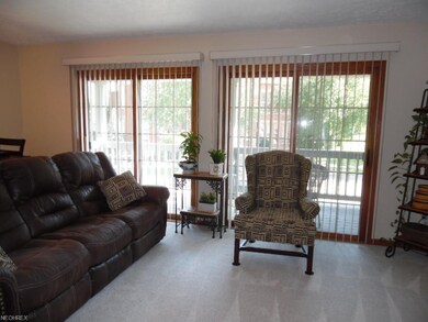 Great Room with new flooring and Patio Door Blinds