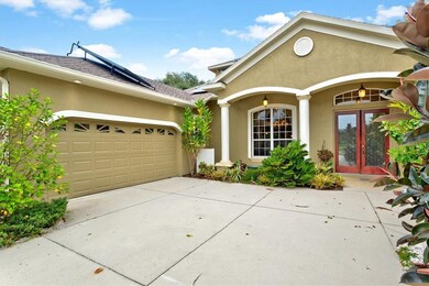 Front view, 2 car side load garage on left.