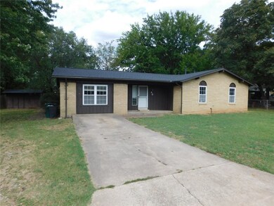 Covered front porch and concrete driveway.
