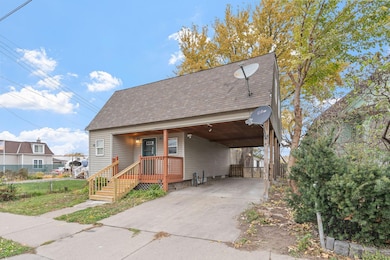 Deep covered carport deep enough for 2 vehicles.